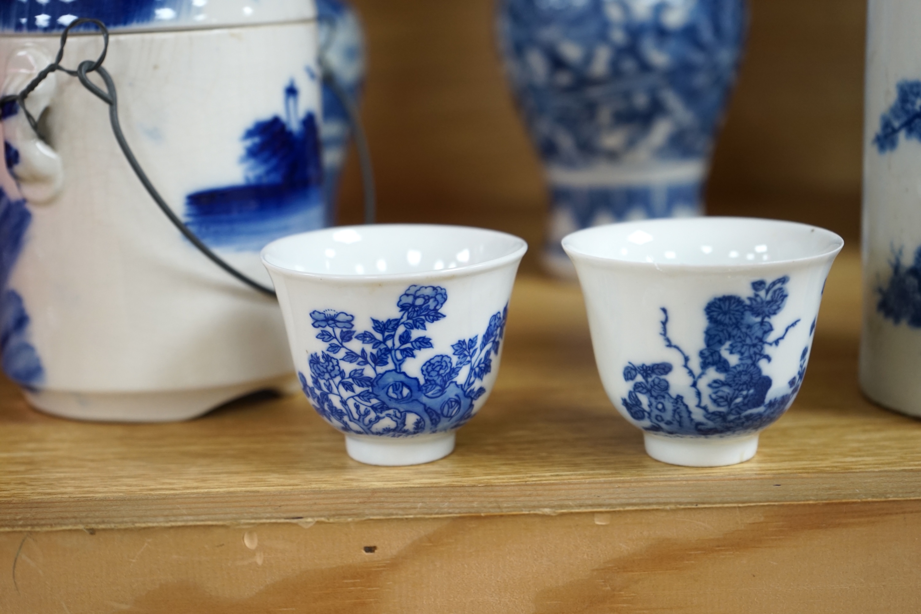 A collection of 19th and 20th century Chinese blue and white vases and tea bowls, largest 21cm high. Condition - varies, mostly poor